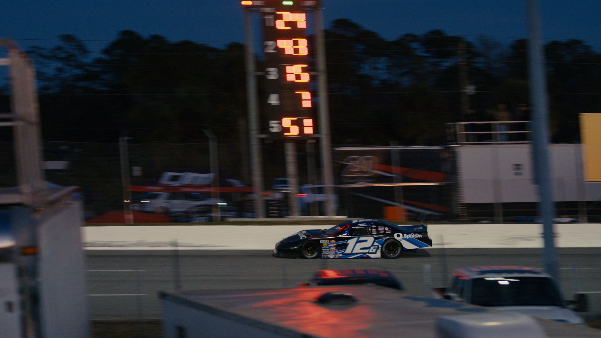 Derek Griffith speeds around the track in his #12 Super Late Model race car