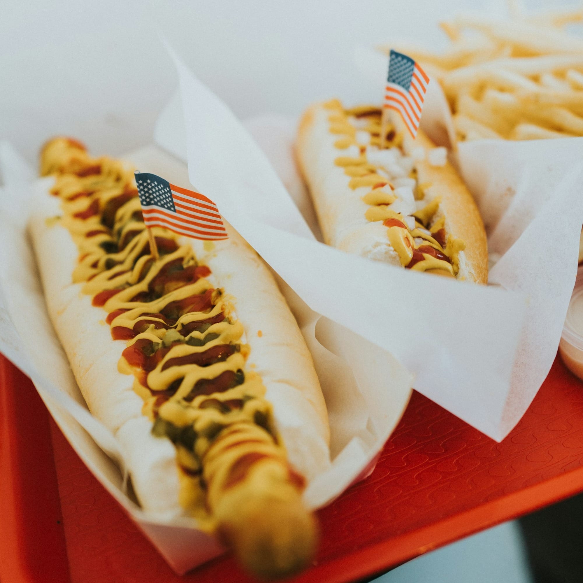 closeup photo of two hotdogs on tray