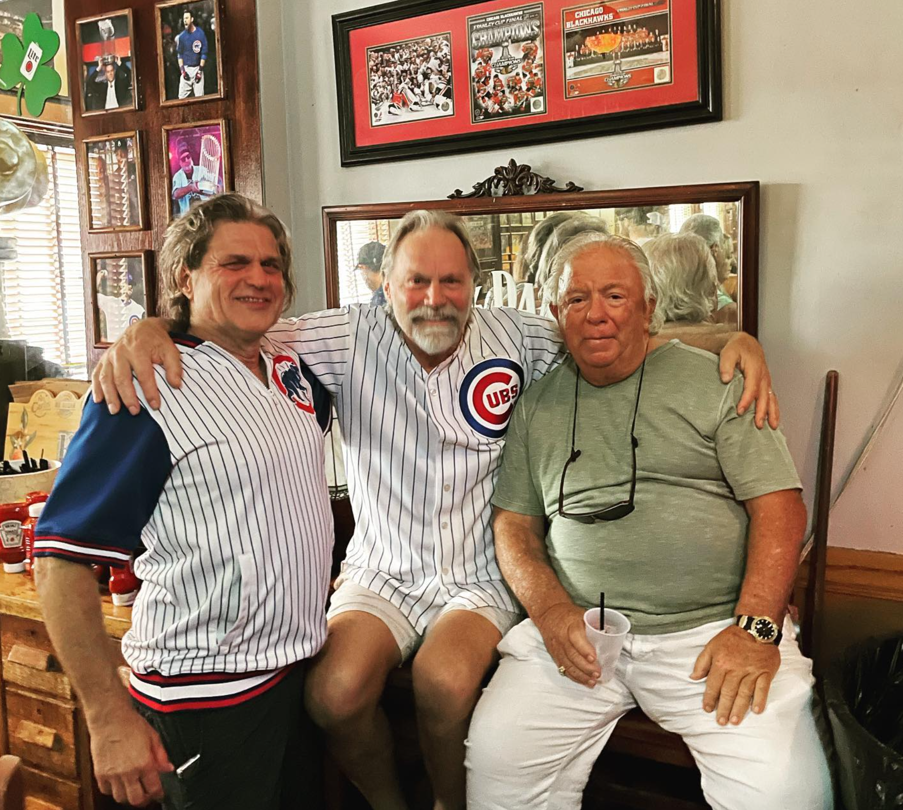 Steve Strauss with Sluggers’ original dueling piano players sitting on a counter