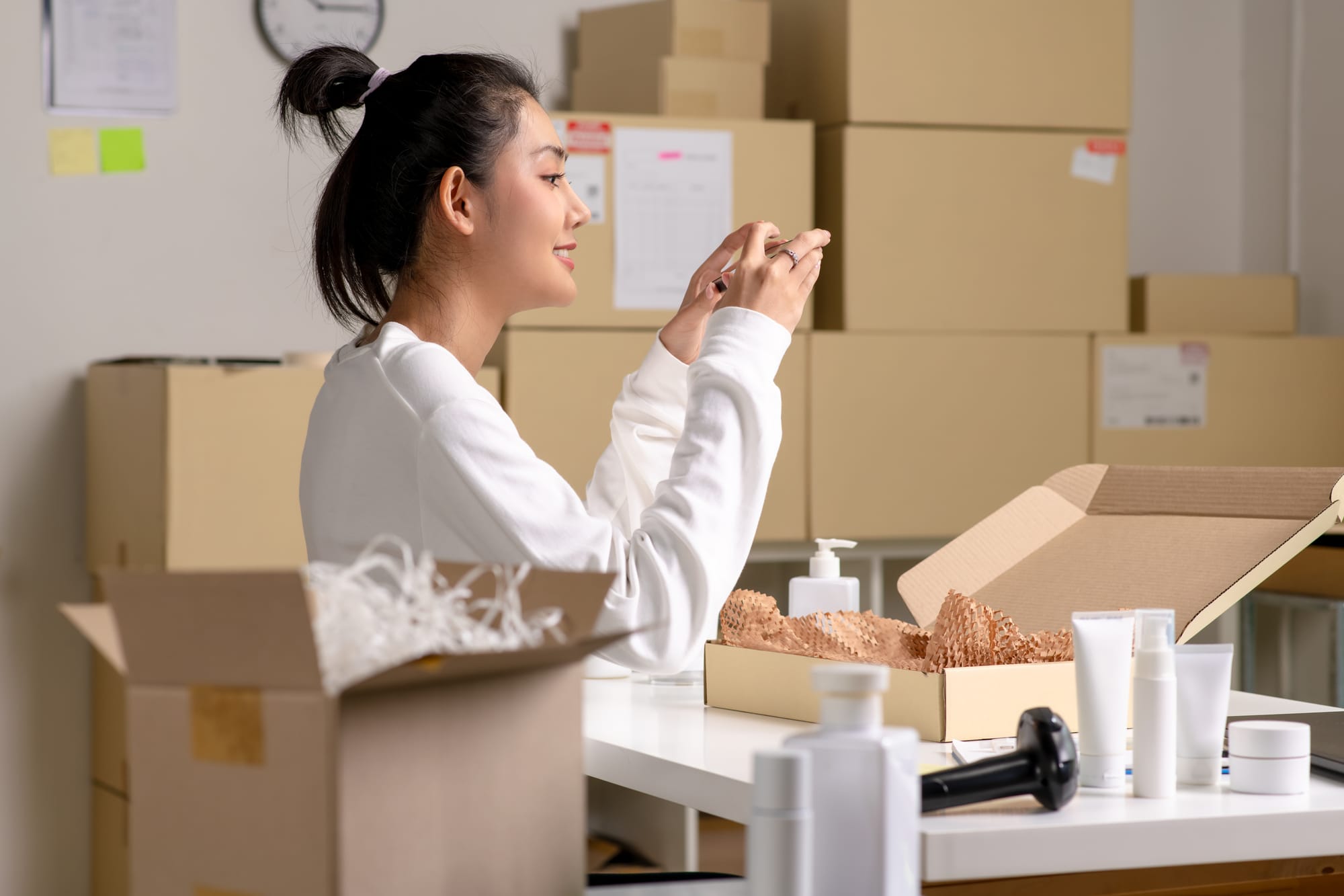 Independant business owner taking photo of products for Google Business Profile