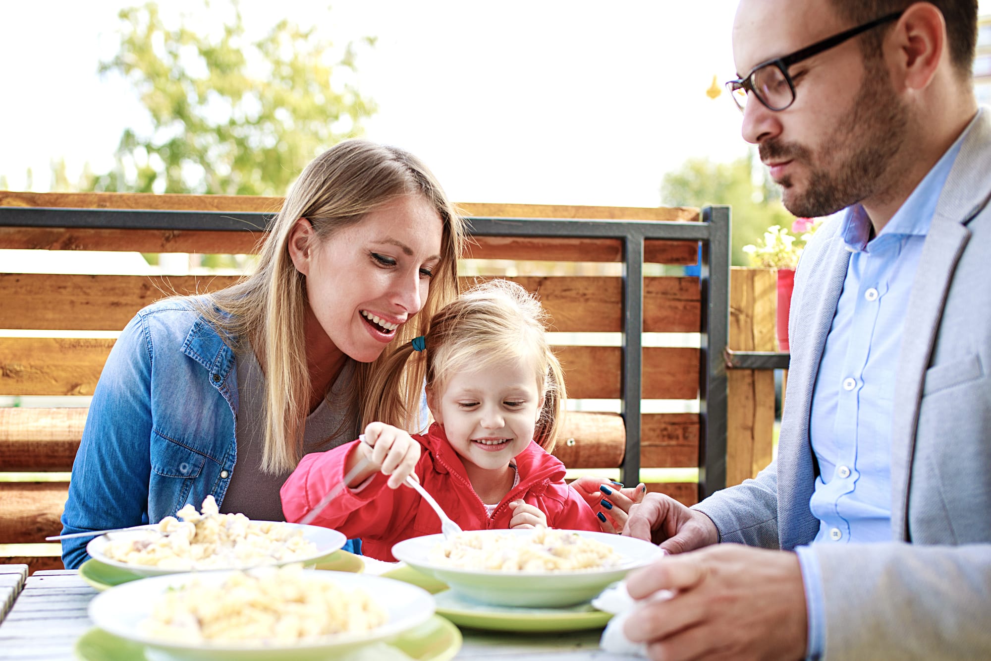 Image of a family in Philadelphia enjoying food at a restaurant.