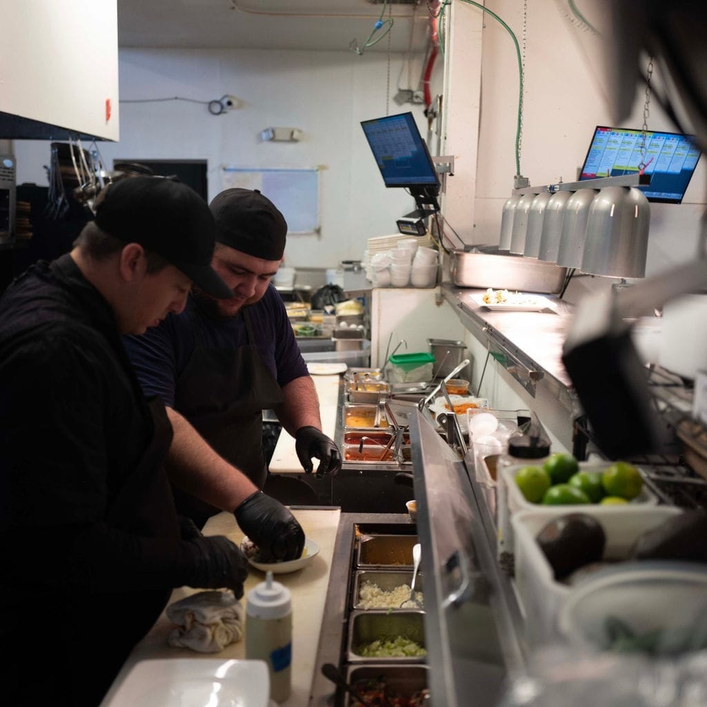 Chefs on the line in a kitchen