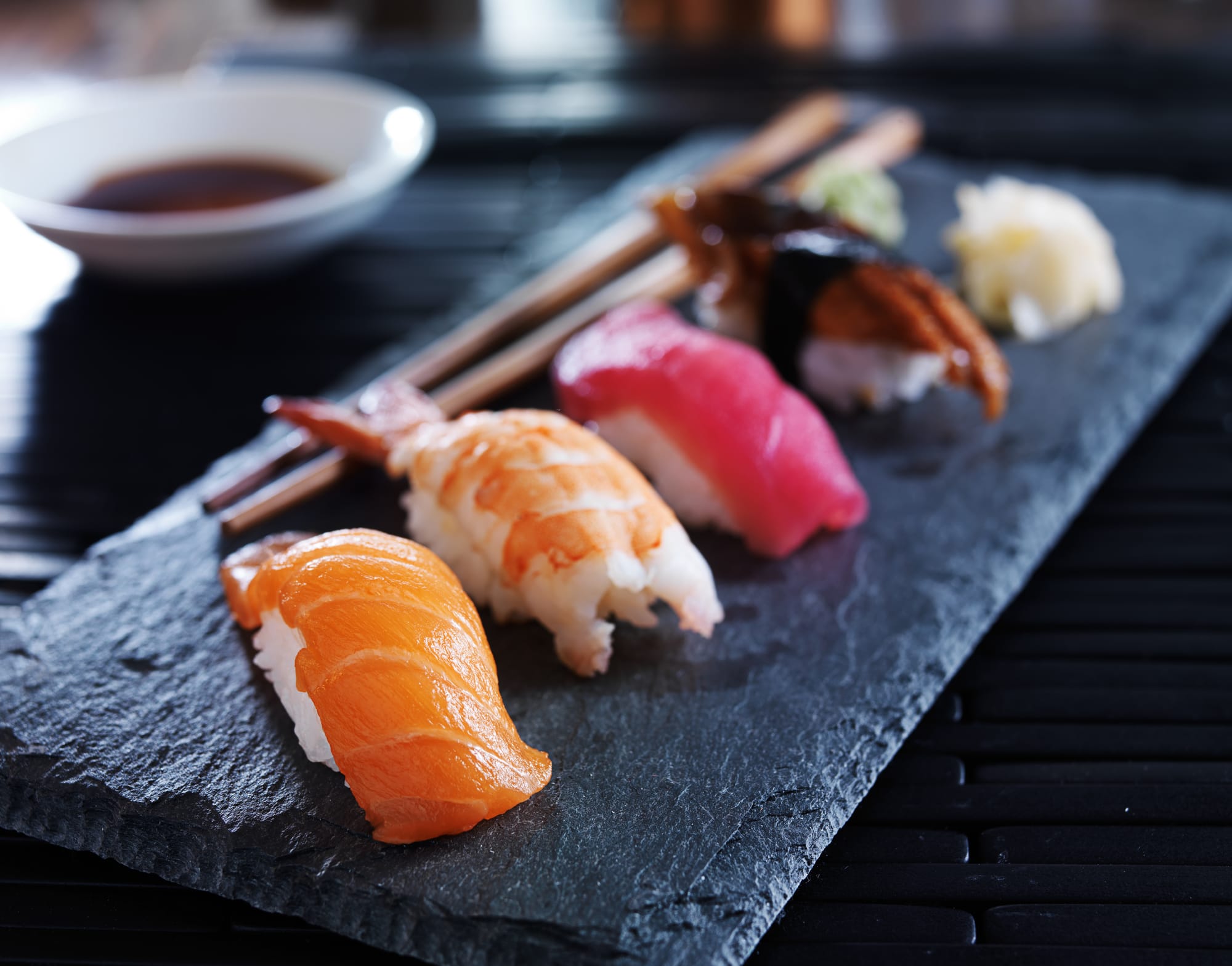 Nigiri sushi with rice and salmon and shrimp vs maki roll