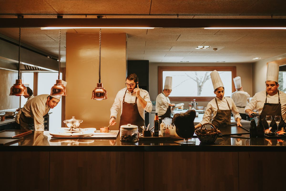 A busy restaurant team works in the kitchen
