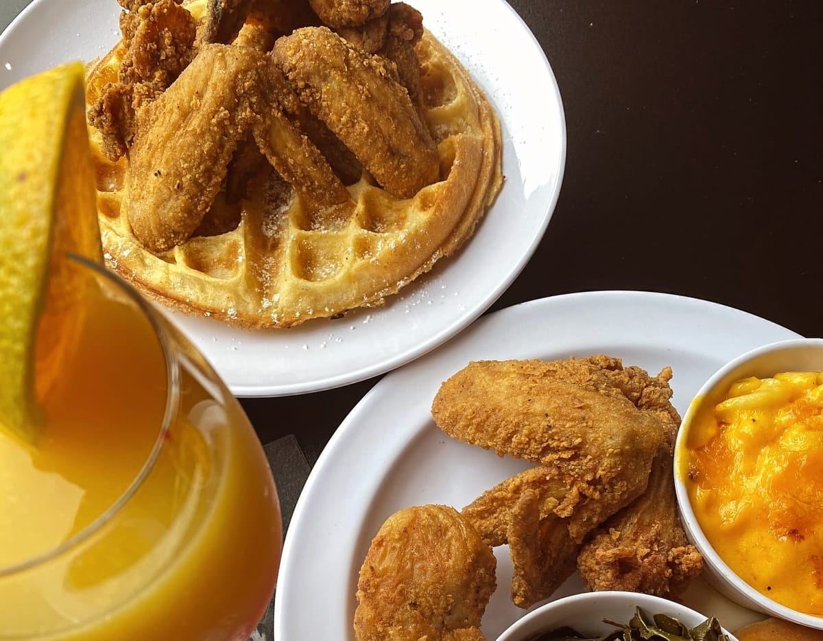 Plates of food from Uptown's Chicken & Waffles in Fayetteville, North Carolina